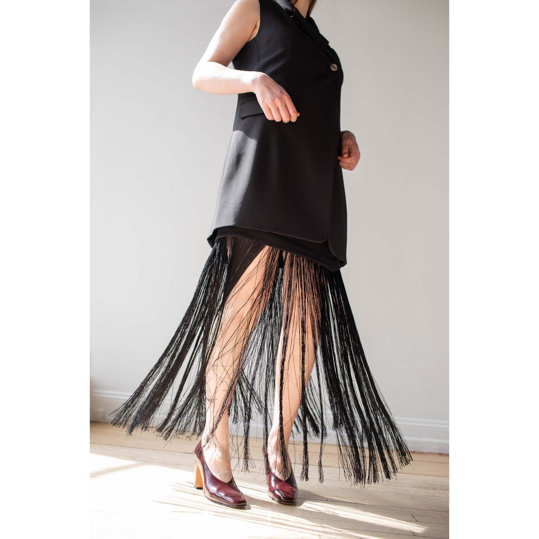 Nomia Asymmetric Fringe Skirt in Black